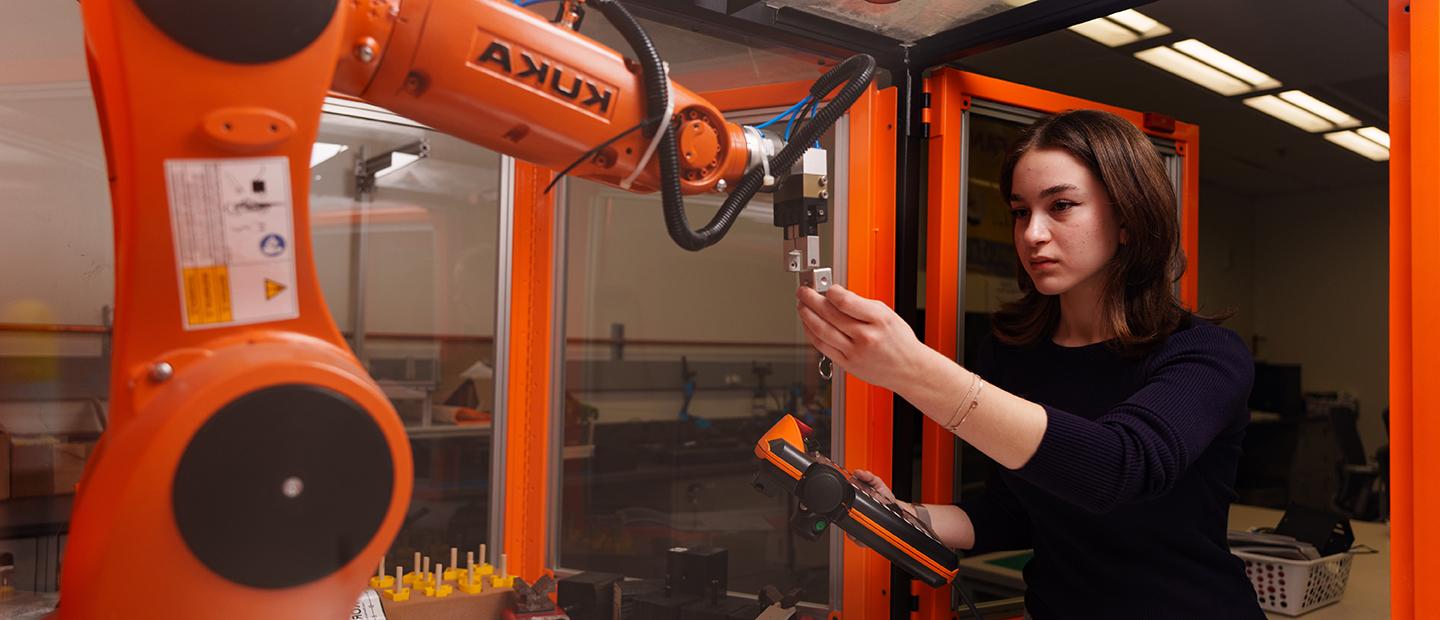 A woman working with industrial equipment