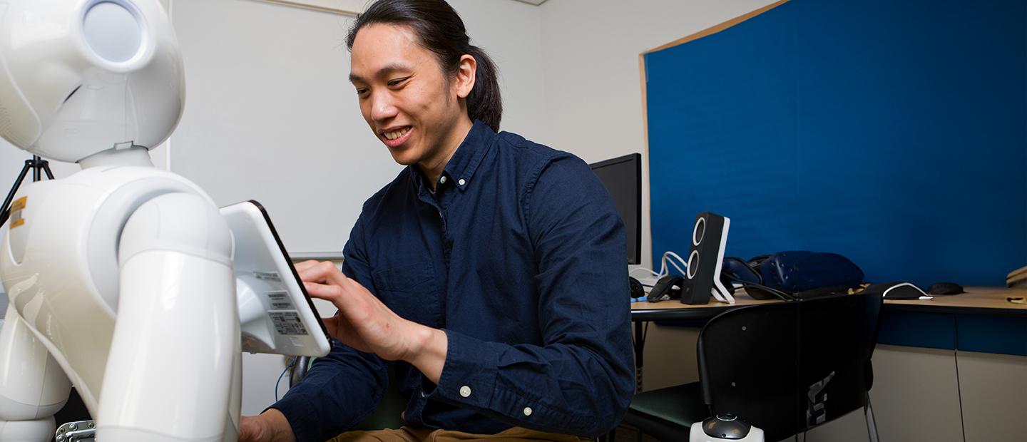 A man working on a robot